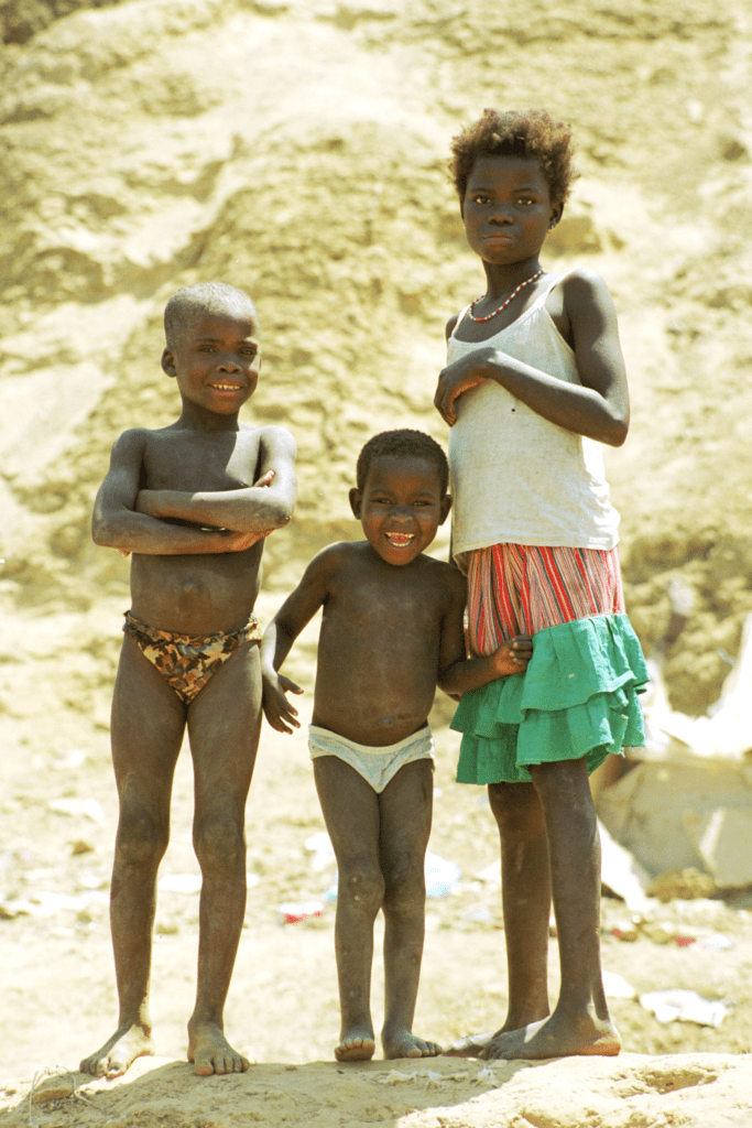 Luanda trio on hill in favella