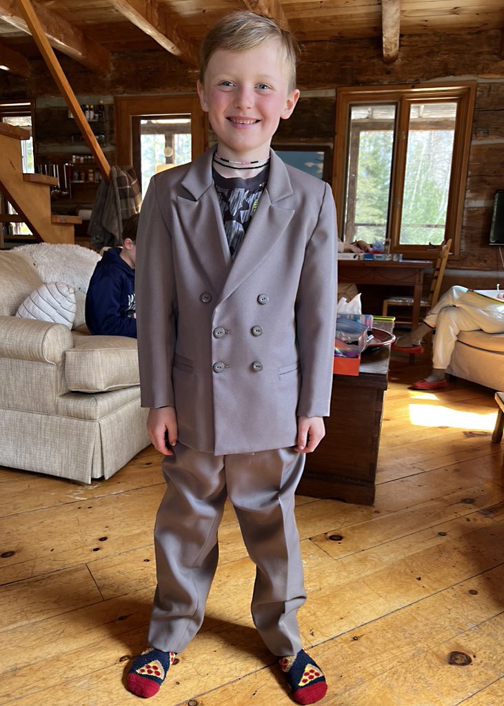 Young boy wearing a suit